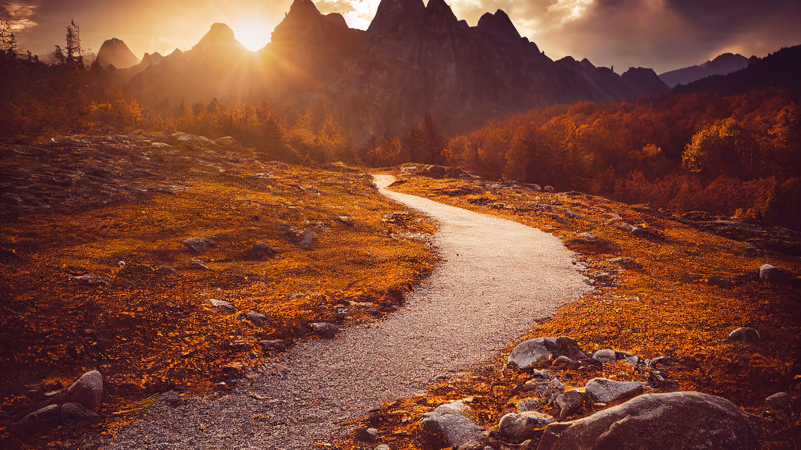 A gravel pathway winding through golden autumn foliage toward sunlit mountain peaks